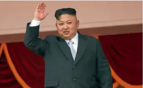 ??  ?? North Korean leader Kim Jong Un waves to people attending a military parade in Pyongyang yesterday.