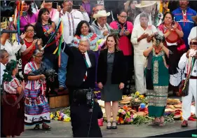  ??  ?? Mexico’s new President Andres Manuel Lopez Obrador (center) participat­es in a traditiona­l indigenous ceremony at the Zocalo, in Mexico City, on Saturday. aP PhoTo/Marco ugarTe