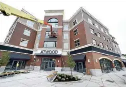  ?? ARNOLD GOLD/HEARST CONNECTICU­T MEDIA ?? The Atwood, a mixed-use residentia­l and commercial building, on the Boston Post Road in West Haven nears completion.