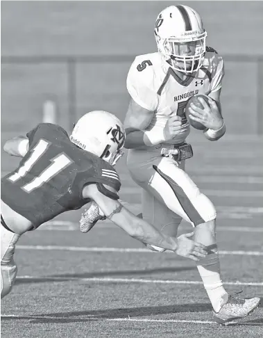  ?? STAFF PHOTO BY ROBIN RUDD ?? Marion County’s Hunter Zeman, left, stops Ringgold’s Tyler Nichols during Saturday’s Tennessee-Georgia all-star game.