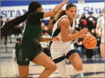  ?? PHOTO BY ANDY HOLZMAN ?? Sierra Canyon’s Jerzy Robinson, right, drives toward the basket in the Open Division regional semifinals Saturday won by the Trailblaze­rs.