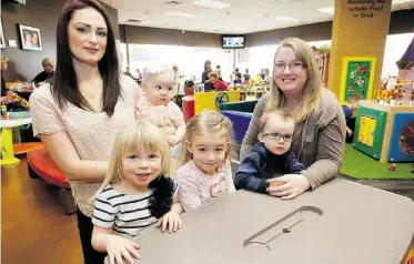  ??  ?? Left, Emma Kolskog with daughters Astrid, 9 months, and Laila, 3; right, Deanna Nielsen with children Madalynn, 4, and Carter, 2