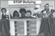  ??  ?? Presentati­on: Turning Point of South Arkansas reprentati­ves Michelle Blackwell, Charleeka Thompson and Danielle Monroe use puppets to present an anti-bullying program at Smackover Elementary School.