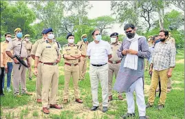  ?? SOURCED ?? Officials inspecting a possible venue for the foundation stone laying ceremony.