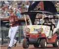  ?? JOE CAMPOREALE/USA TODAY SPORTS ?? Brad Ziegler steps off of the OnTrack bullpen cart.