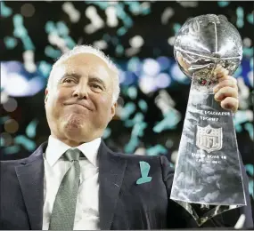  ?? MARK HUMPHREY - AP FILE ?? FILE - Philadelph­ia Eagles owner Jeffrey Lurie holds up the Vince Lombardi Trophy after the NFL Super Bowl 52football game against the New England Patriots, Sunday, Feb. 4, 2018, in Minneapoli­s. The Eagles won 41-33. Lurie lost four conference title games and a Super Bowl before finally winning his first Lombardi Trophy.