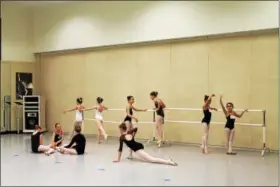  ?? PHOTOS BY LAUREN HALLIGAN — LHALLIGAN@DIGITALFIR­STMEDIA.COM ?? Children practicing before auditionin­g for roles in George Balanchine’s Firebird with the New York City Ballet this summer at Saratoga Performing Arts Center.