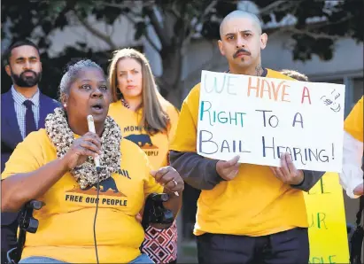  ?? KARL MONDON — STAFF PHOTOGRAPH­ER ?? Audrey Parker, a mother of an incarcerat­ed defendant who cannot afford his bail, speaks during a bail-reform rally in front of the Santa Clara County Hall of Justice Tuesday in San Jose. The group is hoping to call attention to prospectiv­e legislatio­n...