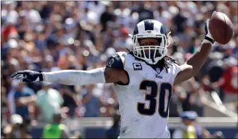  ?? AP PhOTO/MARCIO JOSE SAnChEz ?? Los Angeles Rams running back Todd Gurley celebrates after scoring during the first half of an NFL football game against the Arizona Cardinals on Sunday in Los Angeles.