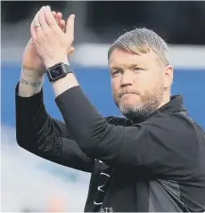  ?? ?? Posh boss Grant McCann applauds the Posh fans after the win at QPR.