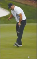  ?? The Associated Press ?? Patrick Reed reacts after making a birdie putt on the 13th hole during the second round of the Masters on Friday in Augusta, Ga. Reed is leading at 9-under 135.