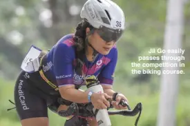  ??  ?? Jil Go easily passes through the competitio­n in the biking course.