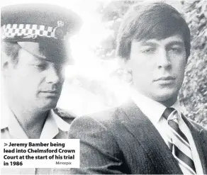  ?? Mirrorpix ?? > Jeremy Bamber being lead into Chelmsford Crown Court at the start of his trial in 1986