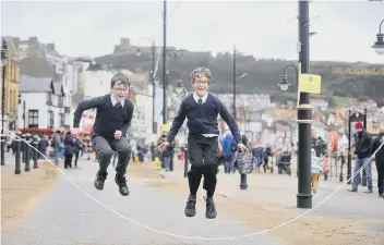  ??  ?? Zak Wormald and Joss Braida have a great time skipping in Foreshore Road. Picture by Richard Ponter