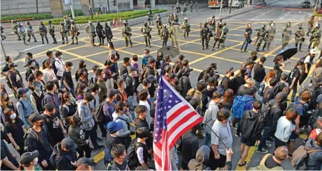  ?? (AFP) ?? People take part in a march from the Tsim Sha Tsui district to Hung Hom in Hong Kong on Sunday