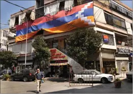  ?? HUSSEIN MALLA — THE ASSOCIATED PRESS ?? A giant flag of the Nagorno-Karabakh region hangs on a building in the main Armenian district of the northern Beirut suburb of Bourj Hammoud, Lebanon, on Monday.