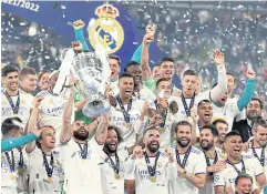  ?? REUTERS ?? Real Madrid players celebrate winning the Champions League last year.