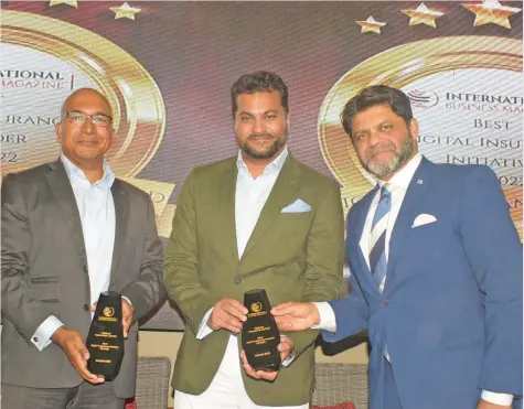  ?? Photo: Ronald Kumar ?? From left-Fiji Care Chairman Dumith Fernando and Executive Director Avi Raju receive their internatio­nal award from acting Prime Minister and Attorney-General Aiyaz Sayed-Khaiyum during FijiCare’s 30 year celebratio­n at the GPH on June 29, 2022.