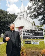  ??  ?? The Rev. Greg Plata speaks Friday outside St. Thomas Catholic Church, which he pastors in Lexington, Miss., about the community loss over the slayings of Sister Margaret Held and Sister Paula Merrill, both nurse practition­ers in the town.