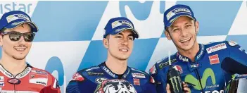  ??  ?? Men on mean machines: Maverick Vinales (centre), Jorge Lorenzo (left) and Valentino Rossi posing after the MotoGP qualifier of the Aragon Grand Prix in Alcaniz yesterday. — AFP