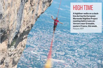  ?? Picture: AFP ?? A highliner walks on a slackline during the European Marmotte Highline Project meeting held in Lans-enVercors near Grenoble, eastern France, this week.