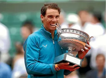  ?? GETTY IMAGES ?? Rafael Nadal with his trophy after beating Dominic Thiem in the final yesterday.