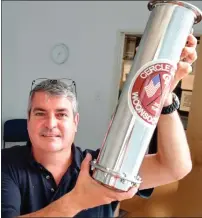  ?? Photo by Russ Olivo ?? Gary Lapierre, a life member of the Cercle Laurier Club, holds up the time capsule that the club will bury in October, with plans to unearth it 25 years from now. It will be sealed with numerous mementos relating to the club — including a copy of this...