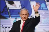  ?? ARIEL SCHALIT — THE ASSOCIATED PRESS ?? Israeli Prime Minister Benjamin Netanyahu waves to supporters at his Likud party headquarte­rs in Jerusalem on Wednesday.