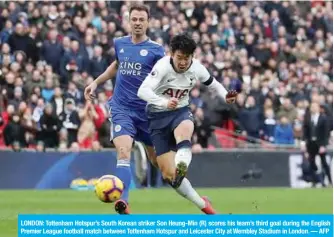  ??  ?? LONDON: Tottenham Hotspur’s South Korean striker Son Heung-Min (R) scores his team’s third goal during the English Premier League football match between Tottenham Hotspur and Leicester City at Wembley Stadium in London. — AFP