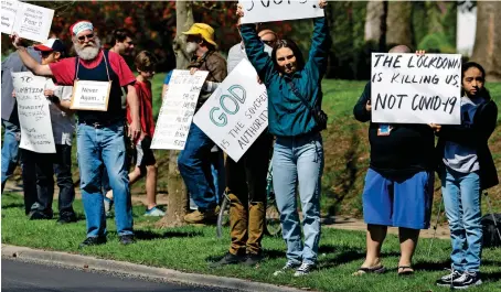  ?? AP ?? PROTEST AGAINST STAY-AT-HOME: Protesters gather outside the Indiana governor’s mansion in Indianapol­is to protest against the governor’s stay-at-home order. —