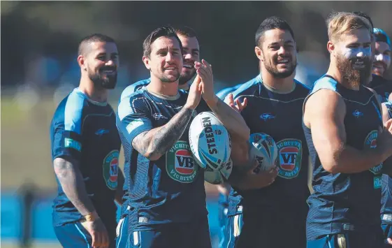  ?? Picture: GETTY IMAGES ?? Mitchell Pearce and teammates enjoy training at Kingscliff ahead of the Origin decider at Suncorp Stadium on Wednesday night.