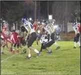  ?? JOHN SANDERS Valley Press Sports Correspond­ent ?? The Lancaster Baptist defense sets up against the California School for the Deaf, Riverside offense during Friday’s CIF-SS 8-man Division 2 quarterfin­al game. The Knights lost 84-12.