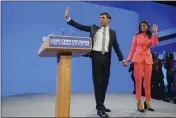  ?? JON SUPER — THE ASSOCIATED PRESS ?? British Prime Minister Rishi Sunak and wife Akshata Murty wave after his speech at the Conservati­ve Party annual conference at Manchester Central convention complex in Manchester, England, Wednesday.