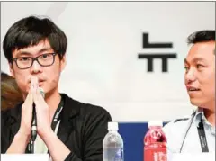  ?? AFP ?? Thai filmmaker Nawapol Thamrongra­ttanarit (left) greets members of the press at the Busan Internatio­nal film Festival in South Korea.