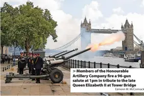 ?? Eamonn M. McCormack ?? > Members of the Honourable Artillery Company fire a 96-gun salute at 1pm in tribute to the late Queen Elizabeth II at Tower Bridge