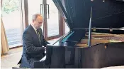  ??  ?? Vladimir Putin relaxed before his talks with the Chinese president in Beijing by playing the piano