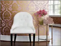  ?? TNS ?? The Thibaut Anna French collection of Marlow wallpaper has a large-scale pattern in a mauvey pink background with a pretty, metallic gold damask.