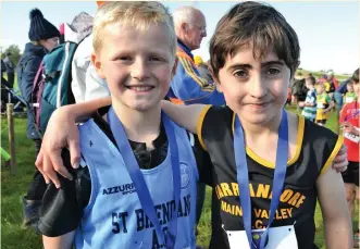  ??  ?? Ben O’Connor (St Brendan’s AC) and Ryan Vickers (Farranfore Maine Valley AC) pictured after both had won medals in the Munster Boys U-10 cross-country championsh­ips. Photo by David Kissane