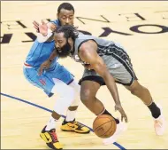  ?? Mark Mulligan / Associated Press ?? Brooklyn Nets guard James Harden, right, drives around Houston Rockets guard John Wall during the first half of a game on Wednesday in Houston.