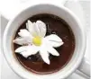  ??  ?? Café Poêtes’ ganache-based hot chocolate comes with a marshmallo­w that “blooms.”