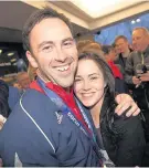  ??  ?? Big smiles David thanked many people for their support including wife Stephanie, seen here greeting him on his return from Sochi