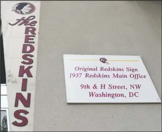  ?? Associated Press ?? ORIGINAL SIGN — Signs for the Washington Redskins are displayed outside FedEx Field in Landover, Maryland, on Monday. The Washington NFL franchise announced Monday that it will drop the “Redskins” name and Indian head logo immediatel­y, bowing to decades of criticism that they are offensive to Native Americans.