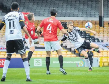  ??  ?? AIM AND FIRE: Port Vale’s Nathan Smith attempts a shot at the Salford City goal on Saturday.