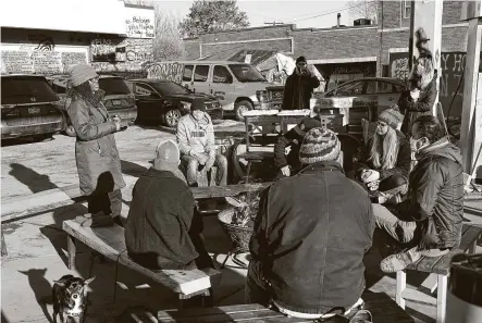  ?? Jim Mone / Associated Press ?? Marcia Howard, left, a group organizer, addresses activists and neighbors Thursday at George Floyd Square in Minneapoli­s. Ten months after Floyd’s death, the square remains as a makeshift memorial for him.