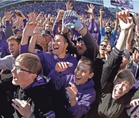  ?? CHARLIE RIEDEL/AP ?? Kansas State fans cheer on the field after upsetting Oklahoma in Manhattan, Kan., on Oct. 26, 2019.