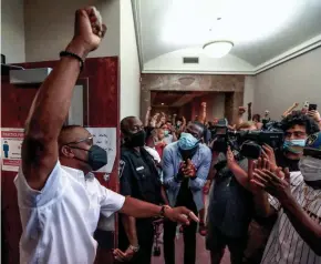  ?? EBONY COX/MILWAUKEE JOURNAL SENTINEL ?? Jay Anderson Sr. rejoices with supporters after Judge Glenn H. Yamahiro announced Wednesday that there is probable cause to charge former Wauwatosa Police Officer Joseph Mensah in the 2016 shooting of Jay Anderson Jr.