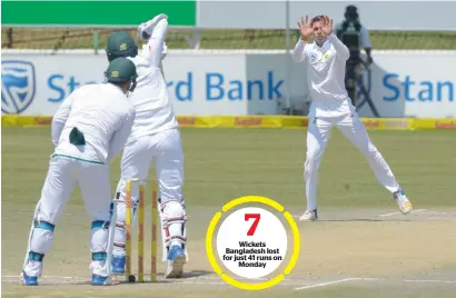  ?? AFP ?? Keshav Maharaj of South Africa takes a return catch of his own bowling on the fifth day of the first Test against Bangladesh. —