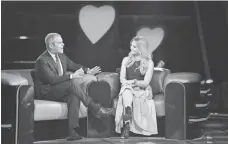  ?? MICHAEL BECKER, FOX ?? Love Connection host Andy Cohen talks to contestant Lauren Walsh. Singles rate dates in Fox’s version of the dating show.