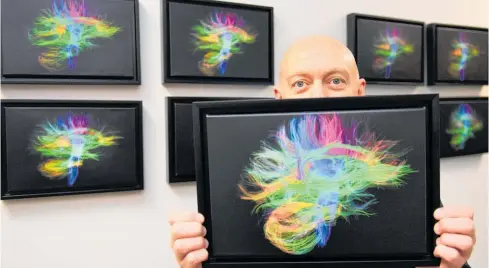  ?? Photo / Otago Daily Times ?? Dunedin Study data manager Antony Ambler shows off a staff member’s brain scan.