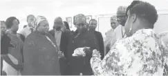  ??  ?? The Minister of State for Industry, Trade and Investment, Hajia Aisha Abubakar with an Exhibitor and participan­ts at AWEP Entreprene­urship Workshop in Abuja on Tuesday